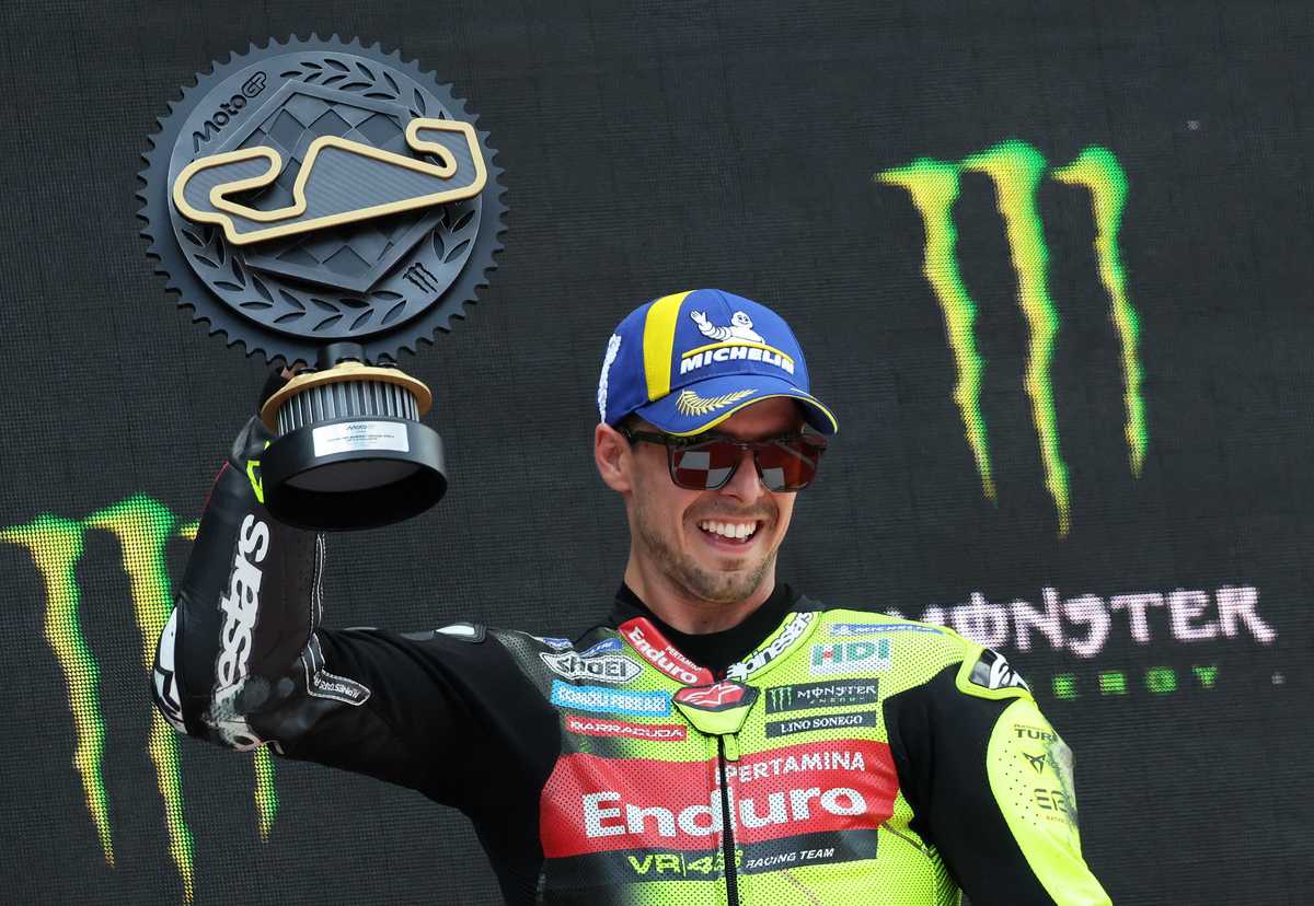 Francesco Di Giannantonio celebrating on his bike during the victory lap after winning the 2026 Catalan Grand Prix