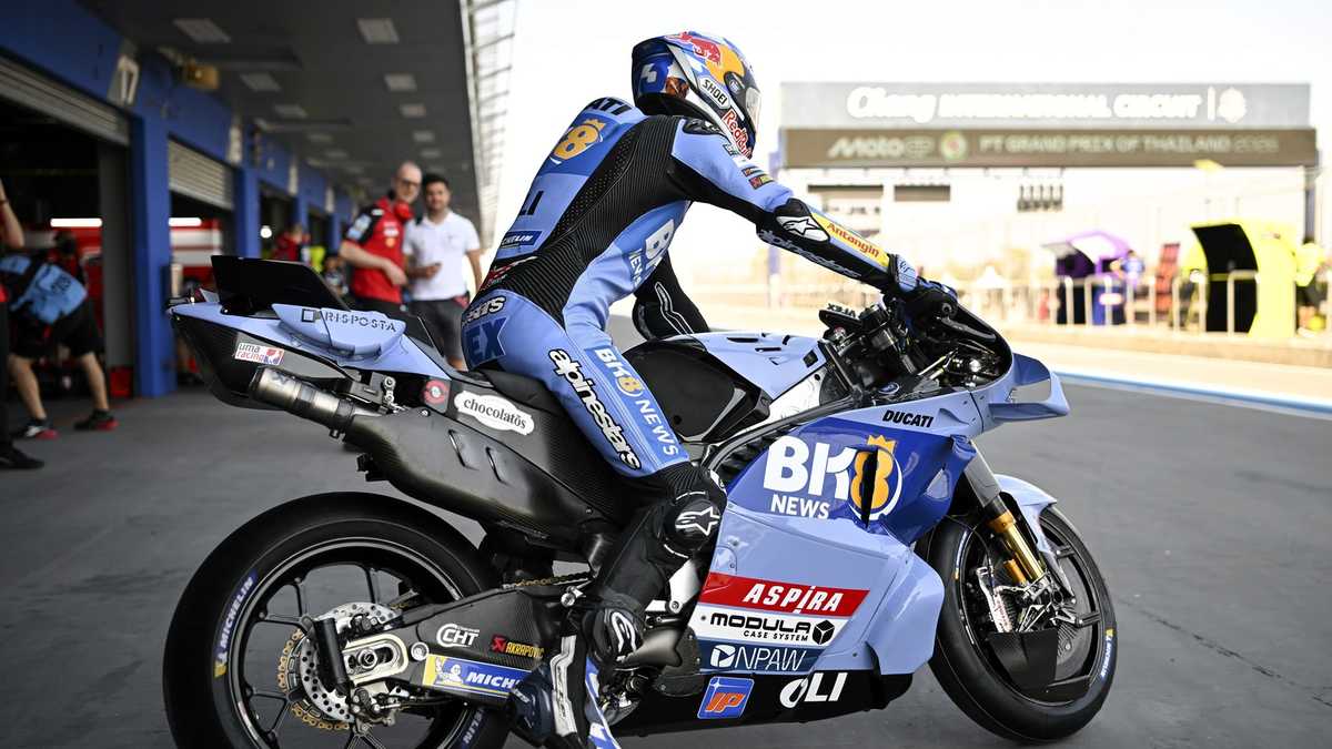 Marco Bezzecchi celebrating on the podium after winning the 2026 Thai Grand Prix at Buriram, holding the winner's trophy…