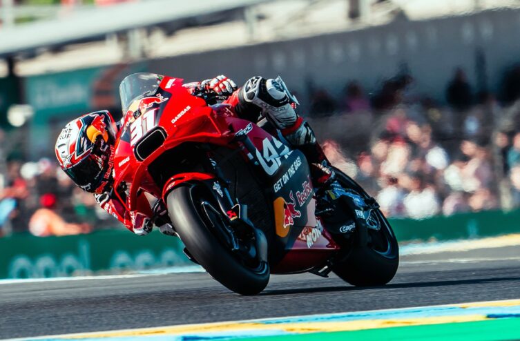 Pedro Acosta applying hard front braking with visible compression of the fork before turn-in