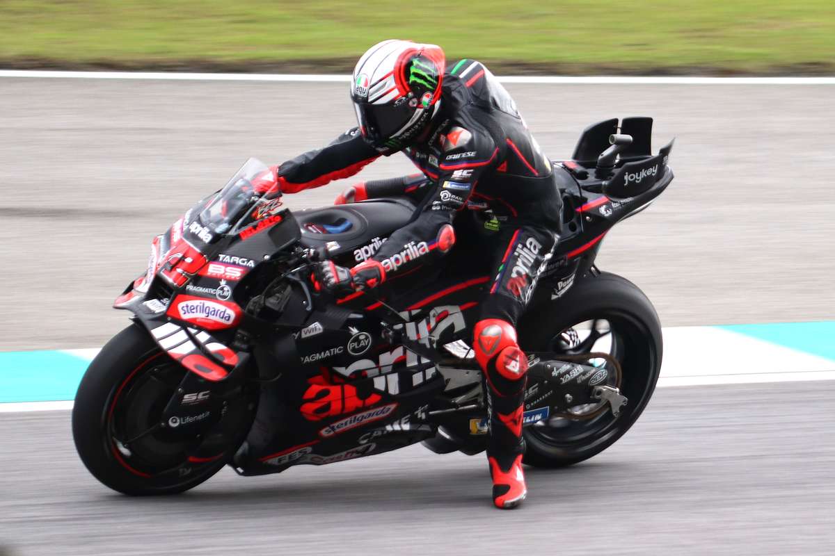Right side profile of the Aprilia RS-GP on track showing fairing, exhaust and race setup