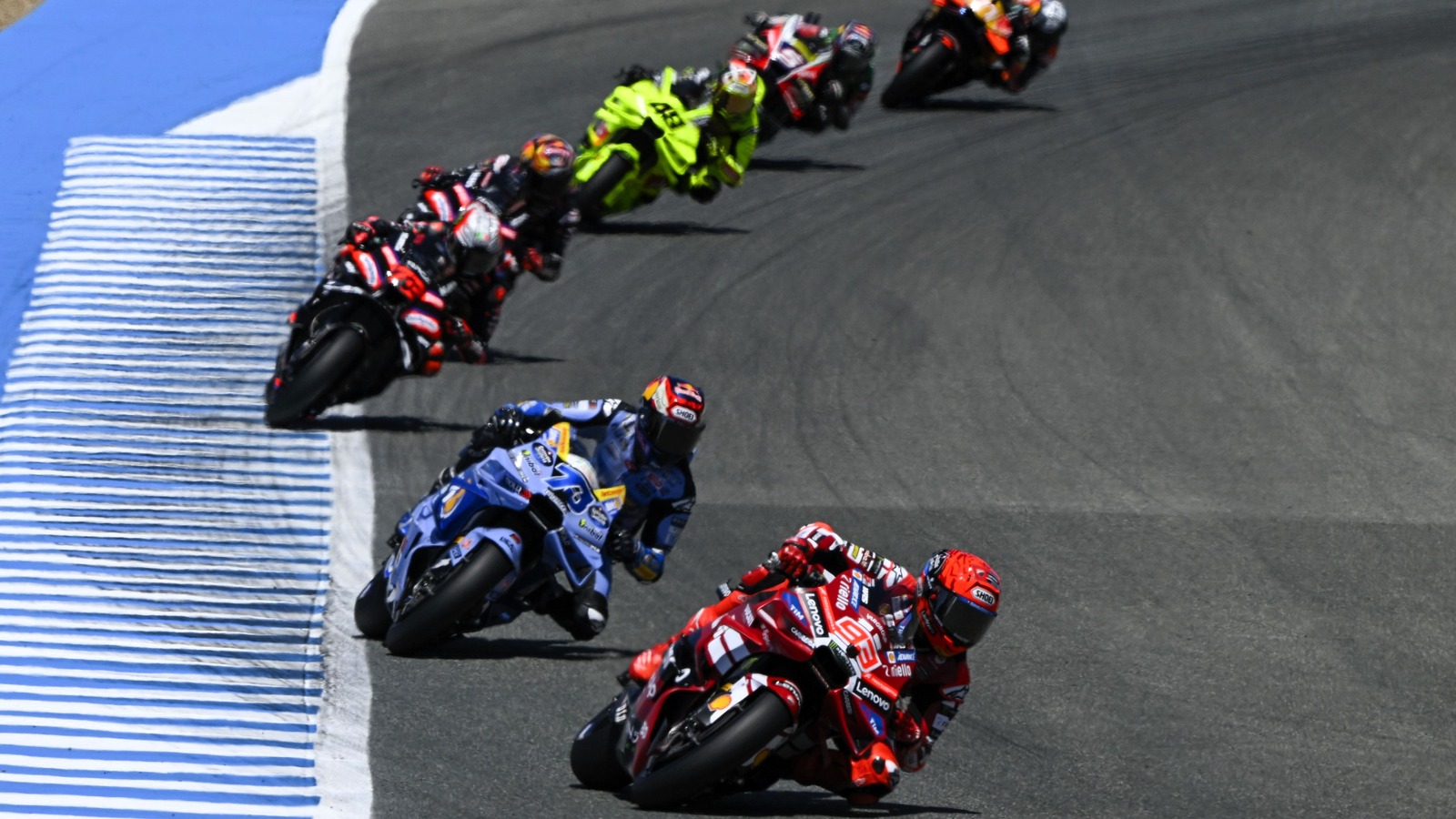 Marco Bezzecchi pushing hard on his bike as he holds second place near the finish at Jerez