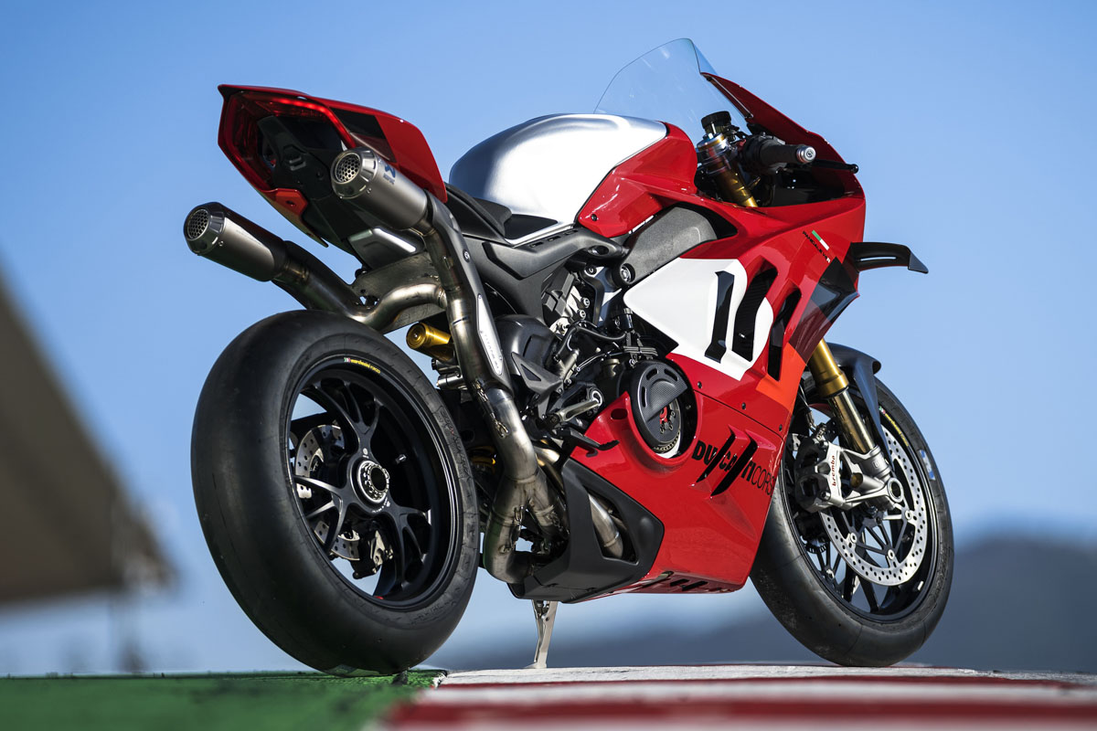 Ducati Desmosedici MotoGP prototype showing exposed race chassis and engineering details on track