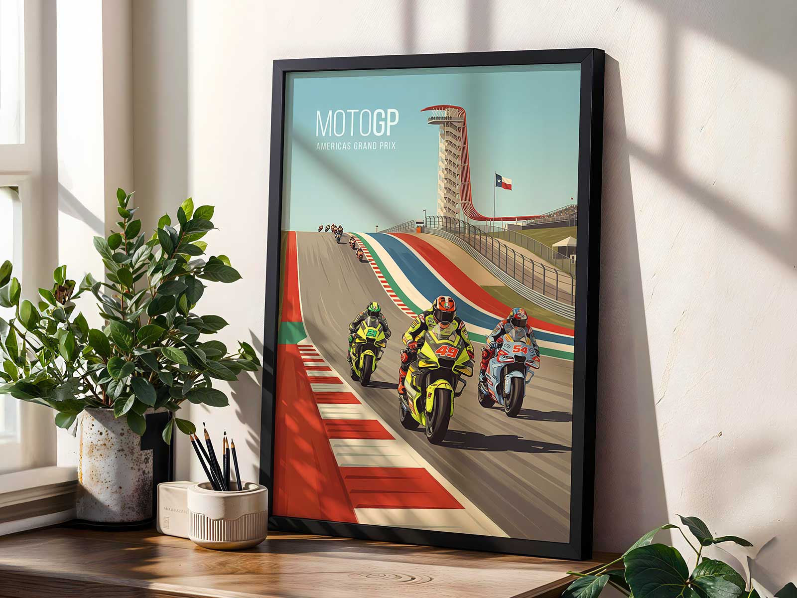 Two MotoGP bikes racing down COTA's long back straight with one slipstreaming the other before heavy braking
