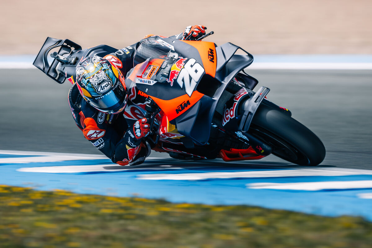 KTM RC16 side view highlighting the orange steel trellis frame and engine integration on the race track