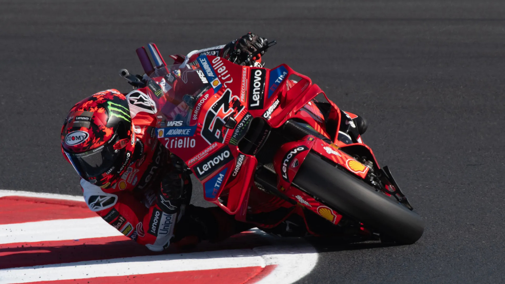 Pecco Bagnaia racing in his early MotoGP season, leaning into a corner with intense focus