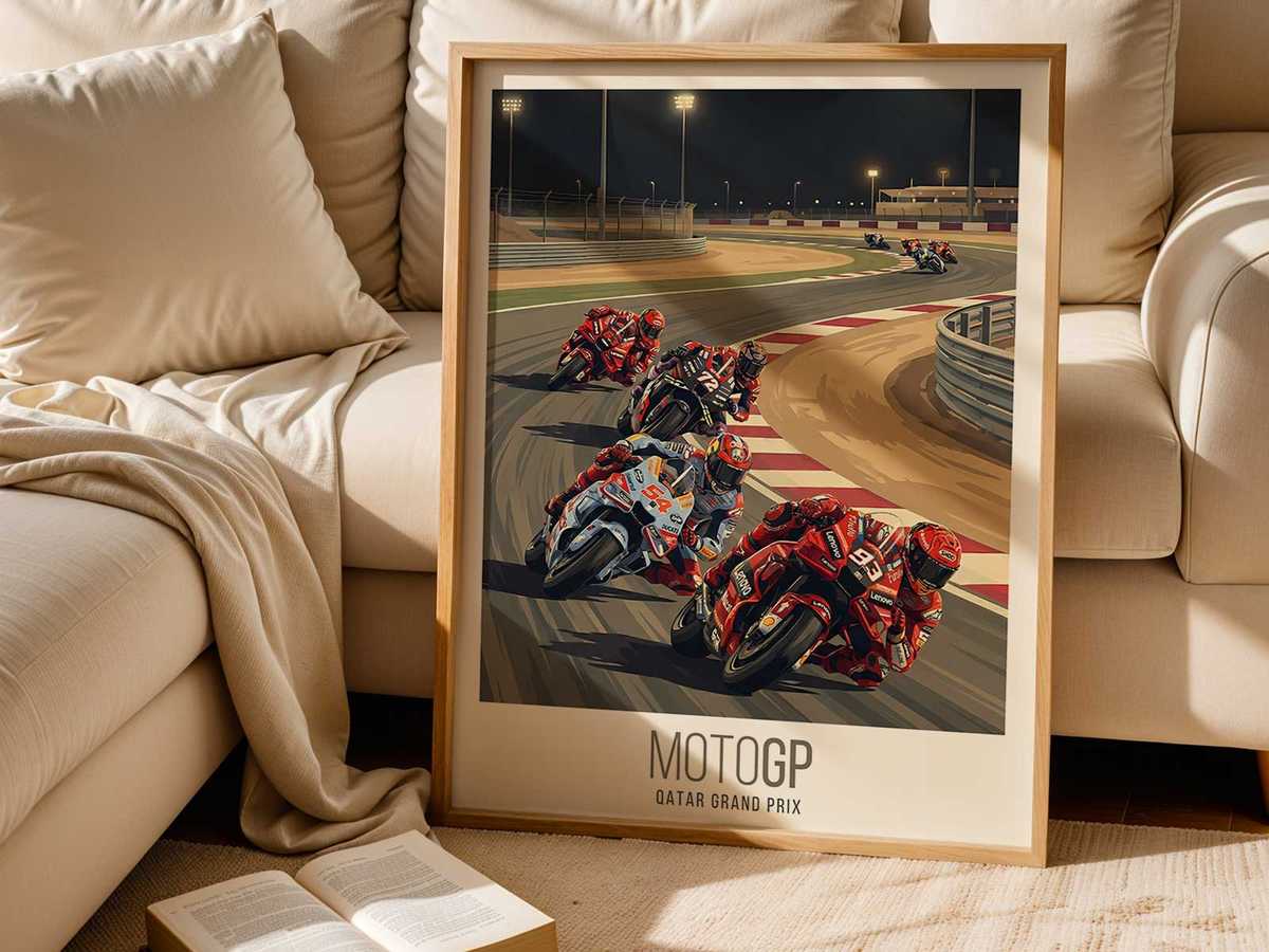 Studio shot of a MotoGP Qatar poster illuminated by a spotlight, capturing dramatic shadows and night-race mood