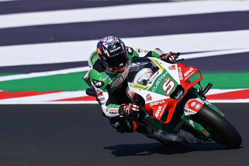 Young Johann Zarco celebrating victory in the Red Bull Rookies Cup holding his trophy on the podium